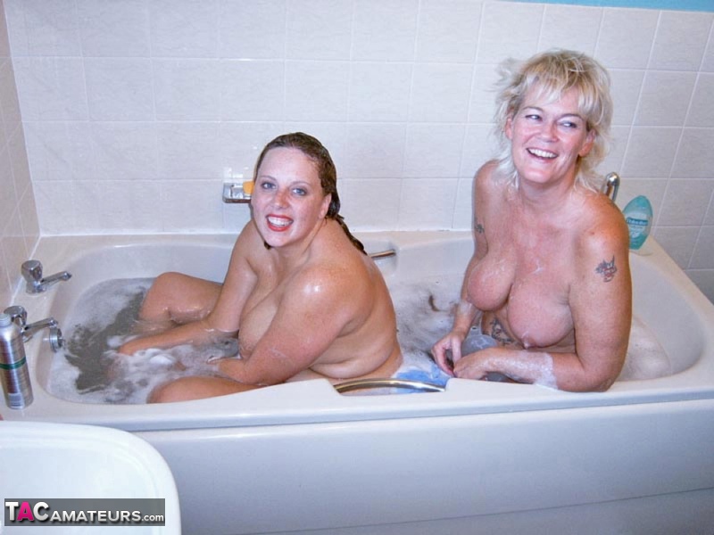 British amateur Curvy Claire and her lesbian friend bathe each other in a tub porn photo #422601793