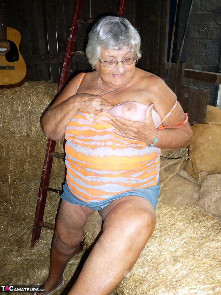 Fat oma Grandma Libby gets naked in a barn while playing acoustic guitar porn photo #425890014
