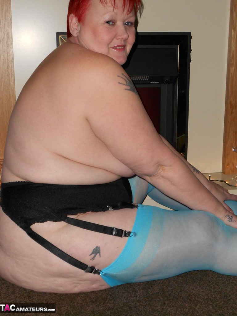 Older redheads are exposed in blue nylons and garters, as seen in the Exposed models.