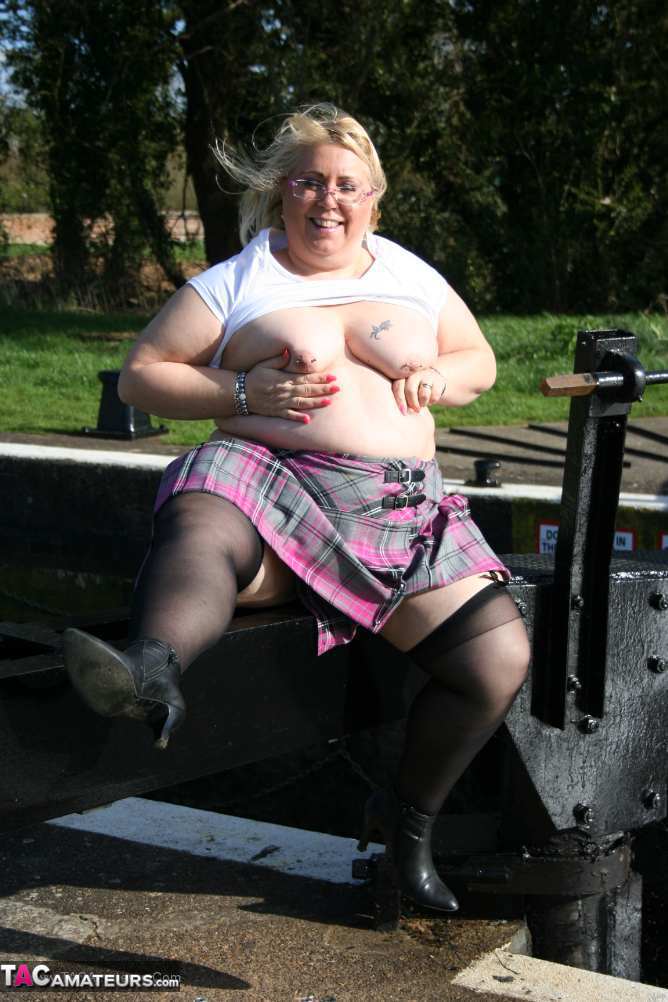 Overweight blonde Lexie Cummings exposes herself by locks on a canal system porn photo #424140690