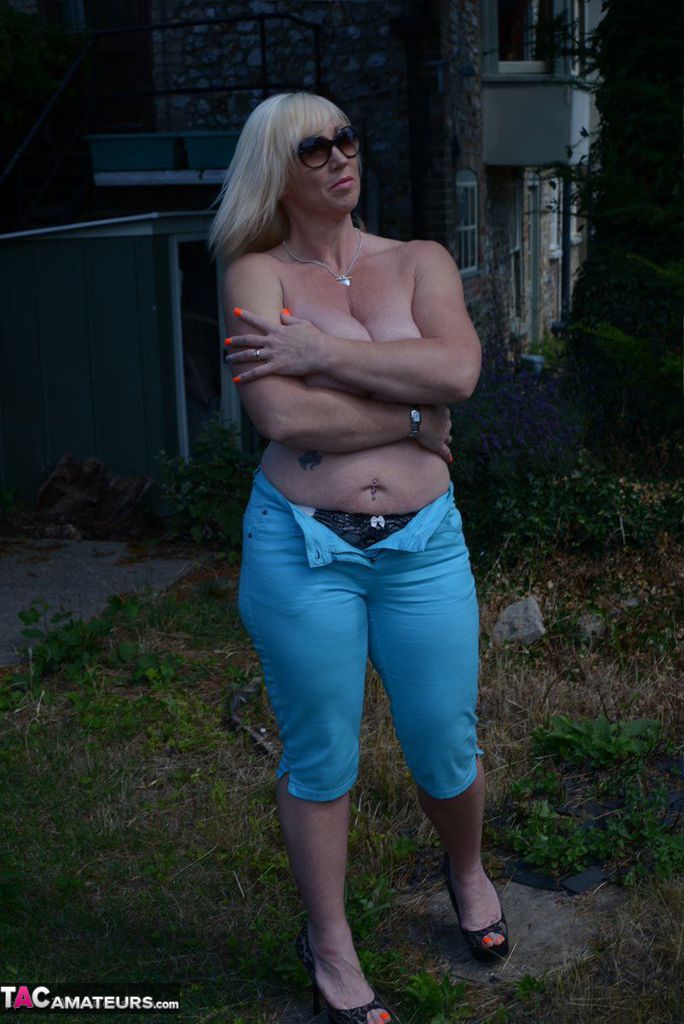 Mature BBW Melody feels the sun's rays on her large tits in the backyard porn photo #425485411