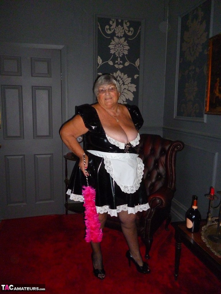 Fat old maid Grandma Libby doffs her uniform to pose nude in stockings foto porno #428350787