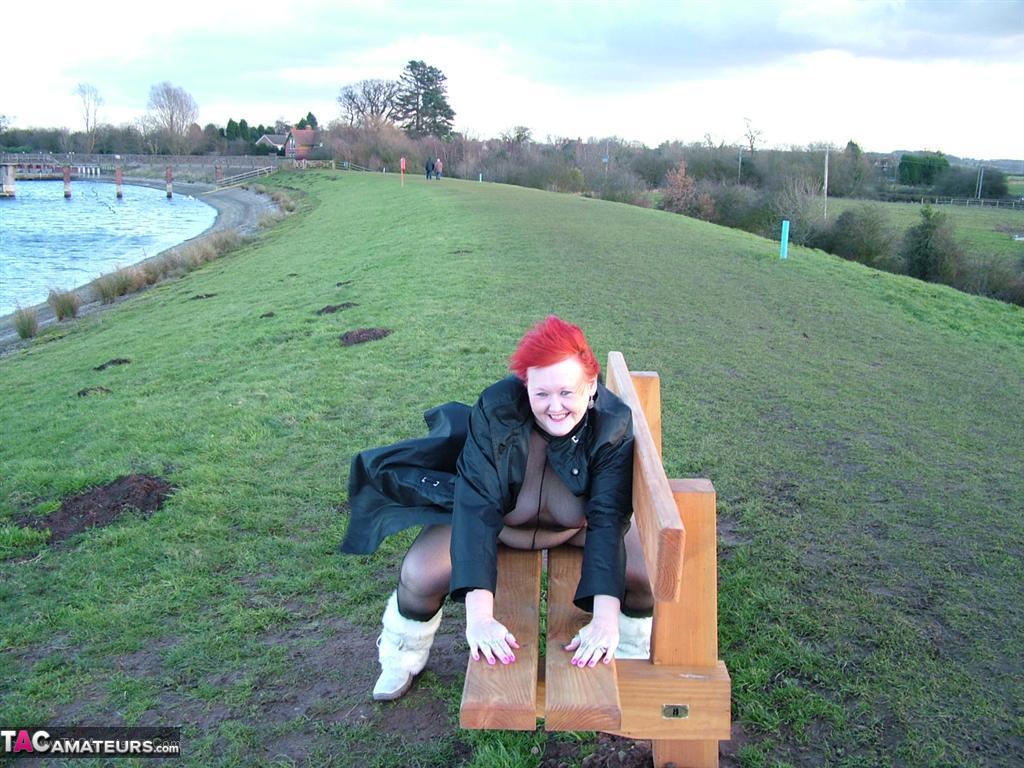 The Redhead Valgasmic Exposed enjoys a playtime in the park wearing only one of her crotchless stocking.