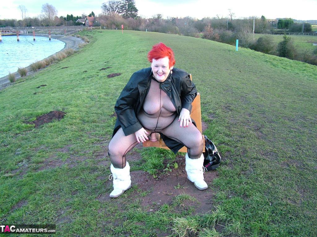 In a park, Redhead Valgasmic Exposed wears nothing and plays with a toy in an open-toed position without a crotch.