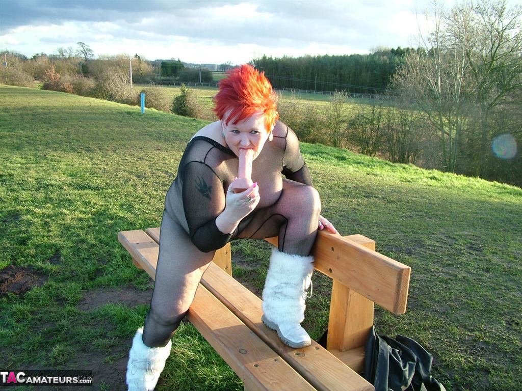 A park playground is where Redhead Valgasmic Exposed plays with a toy in a non-slip cotton ball.