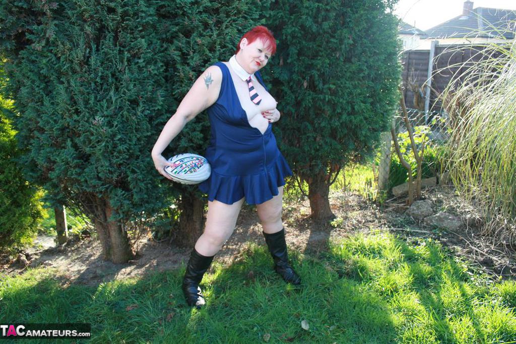Fat redhead Valgasmic Exposed exposes her tits while playing with a football порно фото #426656596