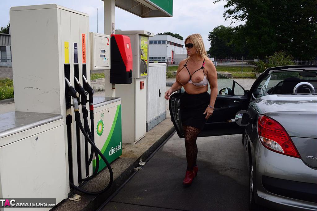 Older blonde Nude Chrissy exposes herself while filling up at a petrol station porn photo #423128413