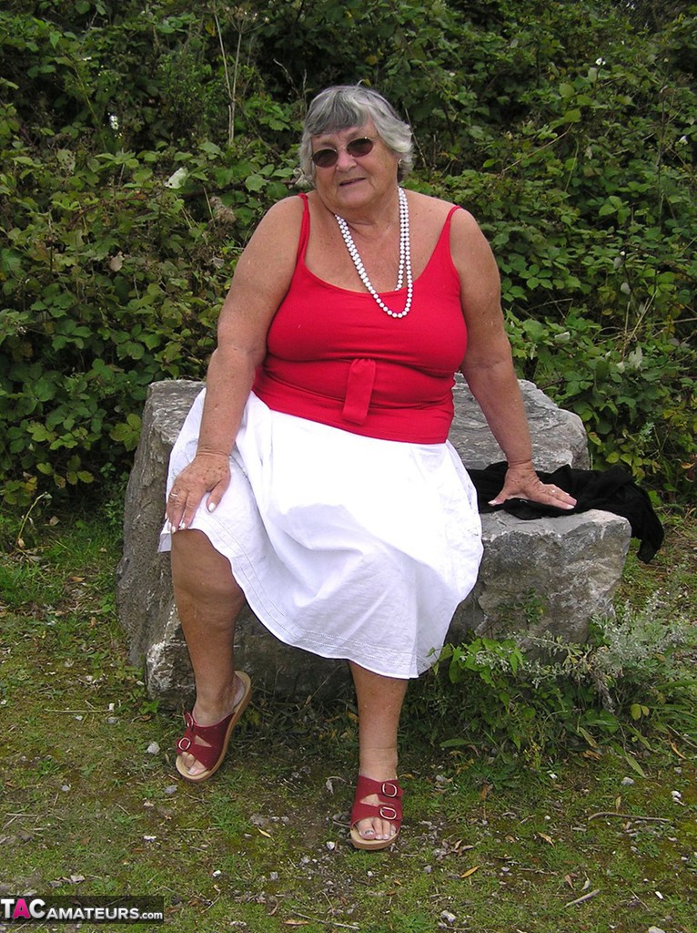 Grandma Libby, who is elderly and amateurish, displays her breasts on a public walking trail.