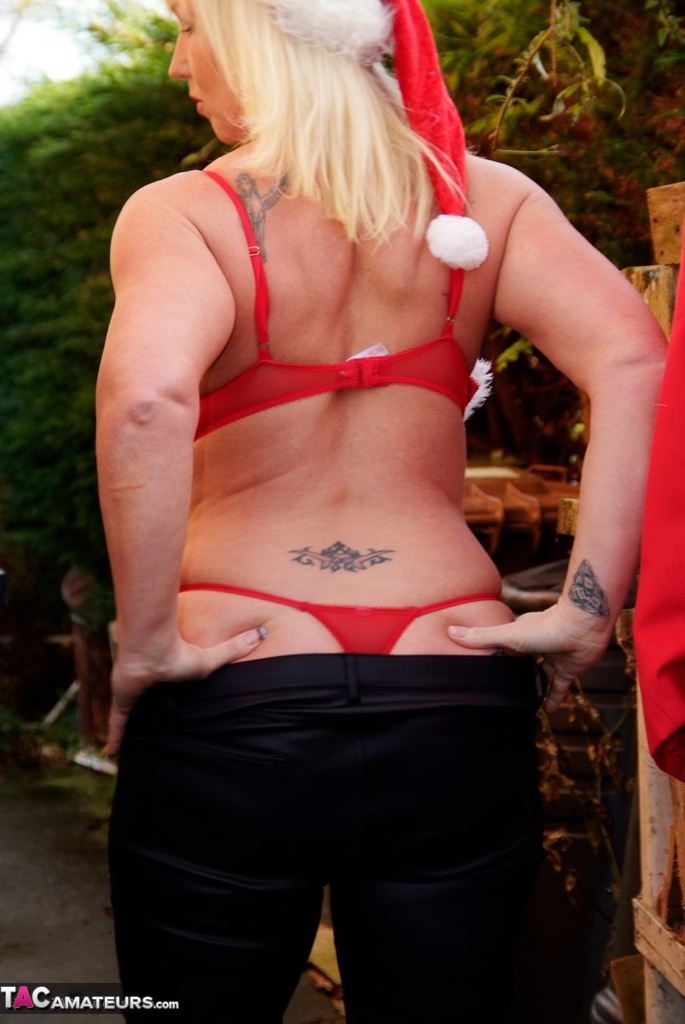 For Christmas Melody (the amateur) is seen with her pierced nipples on as she gets ready to leave the holiday scene.