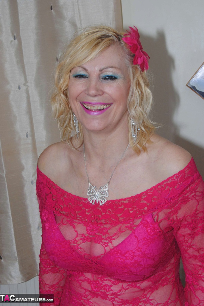 Older blonde Dimonty casually releases her saggy tits from a pink dress porn photo #428041035