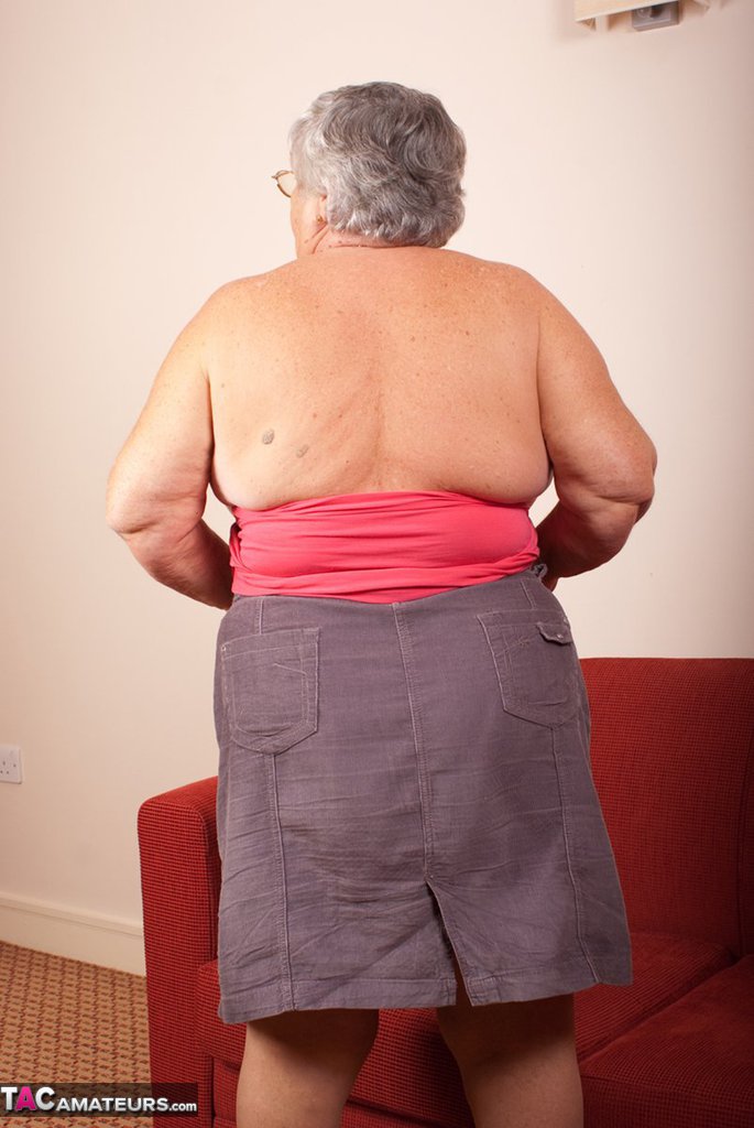 Obese nan Grandma Libby gets totally naked on a red chesterfield porn photo #425392377