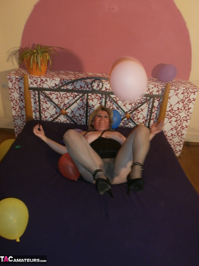 Old Woman Caro Bares Her Tits In Pantyhose Amid Balloons On Her Bed