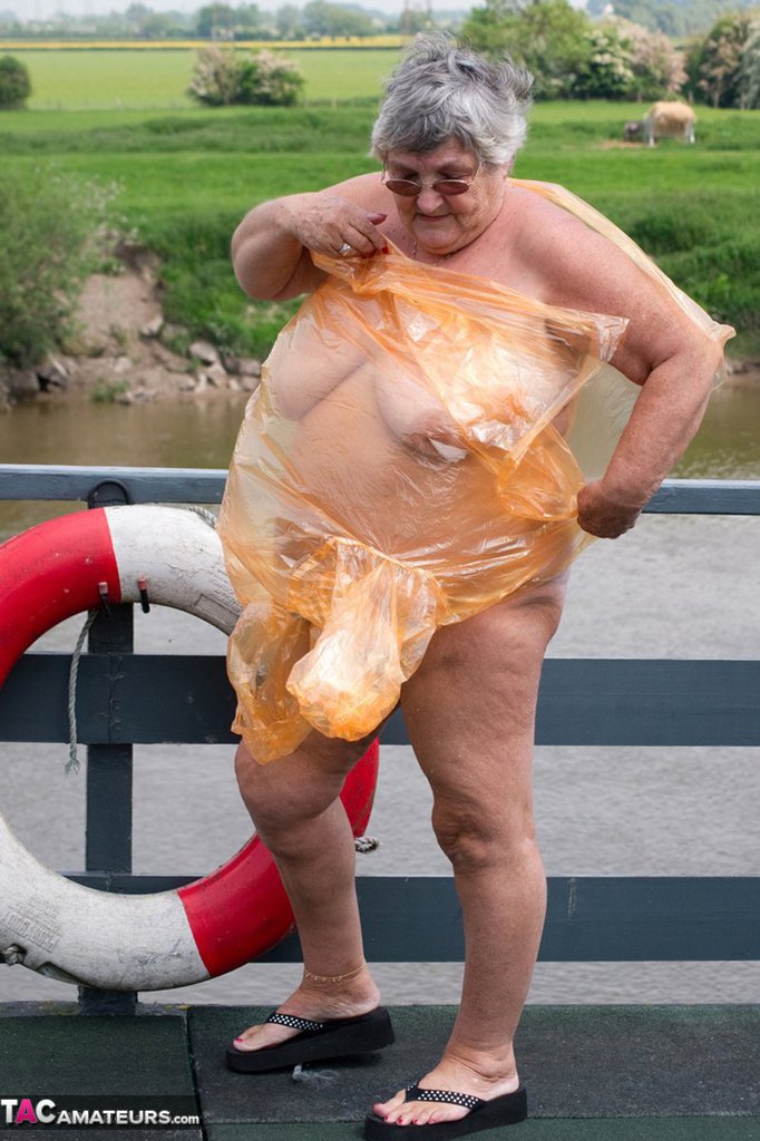 Obese British Amateur Grandma Libby Casts Off A See Through Raincoat