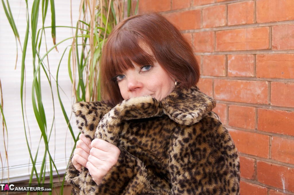Older redhead flashes in a leopard print coat and black stockings photo porno #425173326