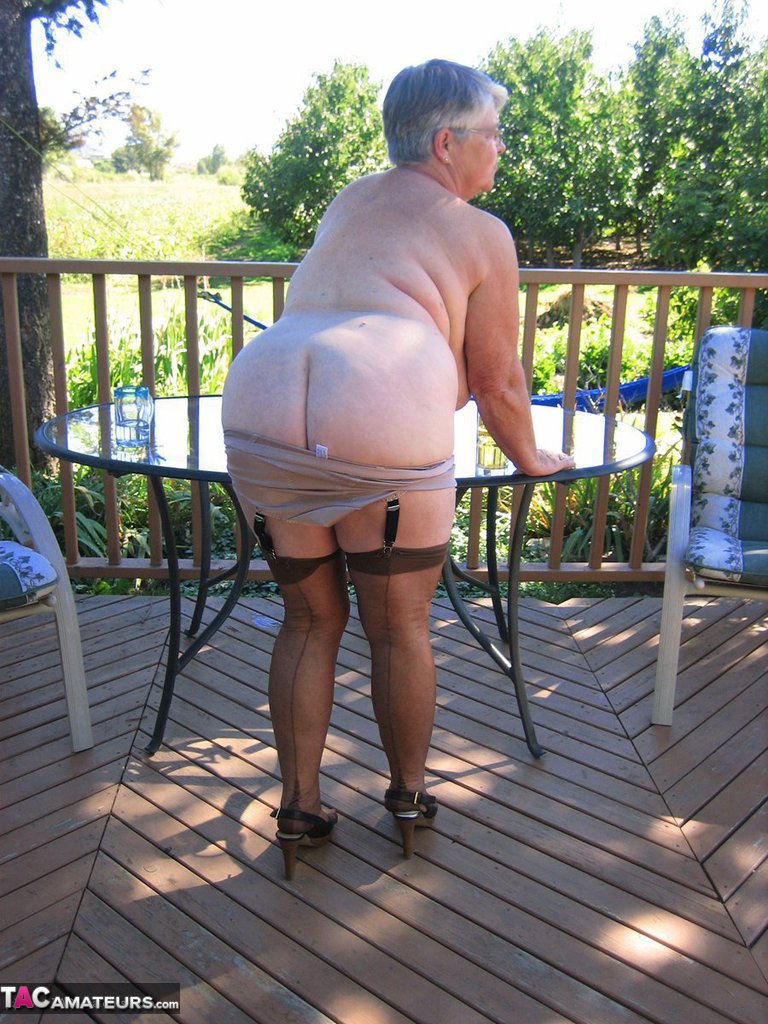 Amateur grandmother Girdle Goddess smokes before getting naked in nylons photo porno #424021742