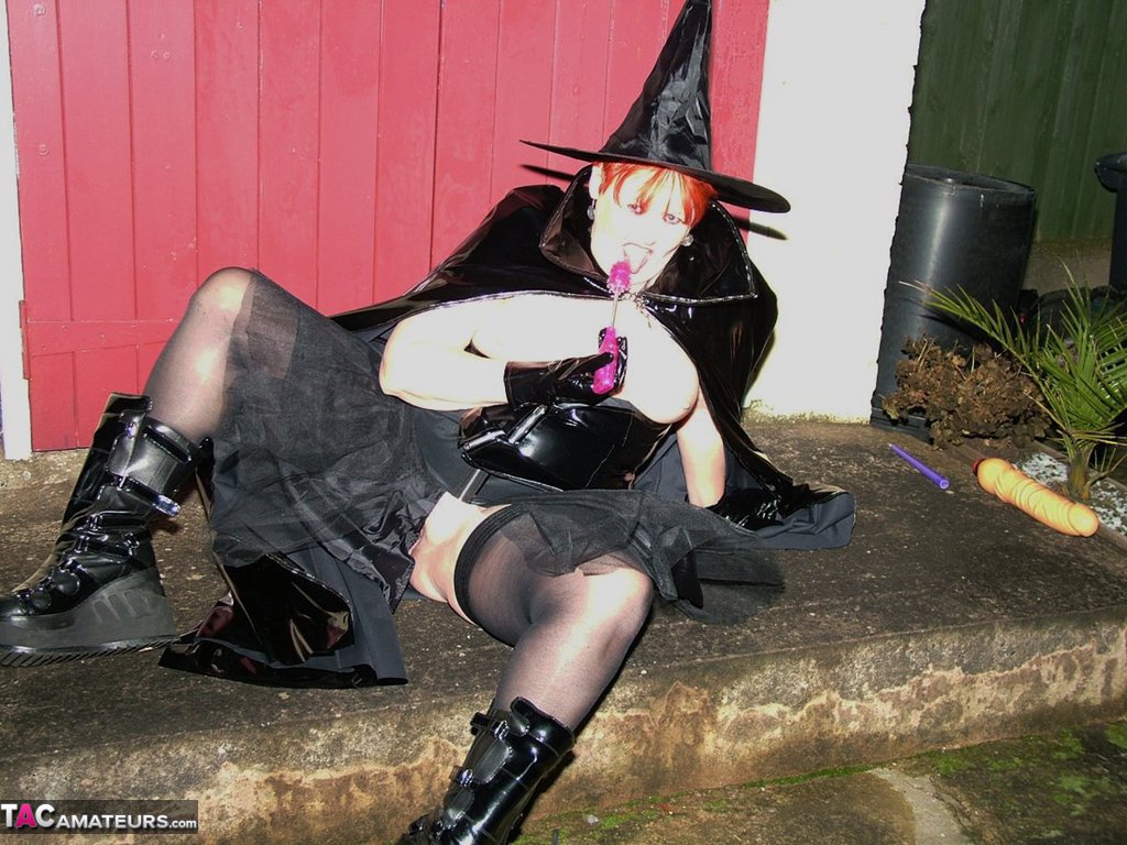Mature redhead Valgasmic Exposed exposes herself in cosplay attire by a shed porn photo #423232906