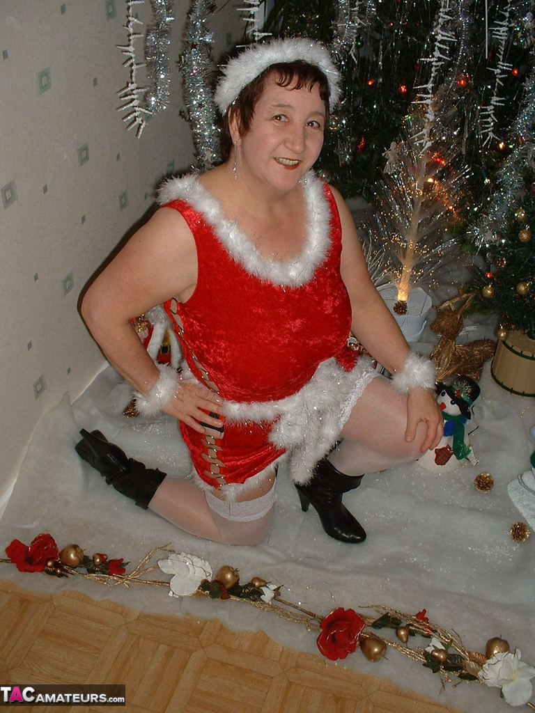 Mature woman Kinky Carol exposes her breasts during a Christmas scene photo porno #422797898