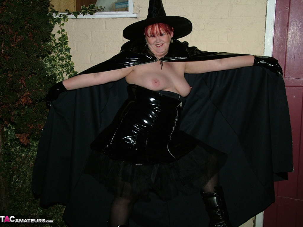 Older redhead Valgasmic Exposed displays her pussy in cosplay wear by the shed Porno-Foto #423200897