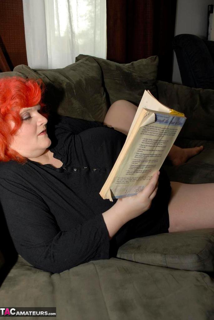 Obese older redhead Black Widow AK fondles herself while reading a romance porn photo #428140269