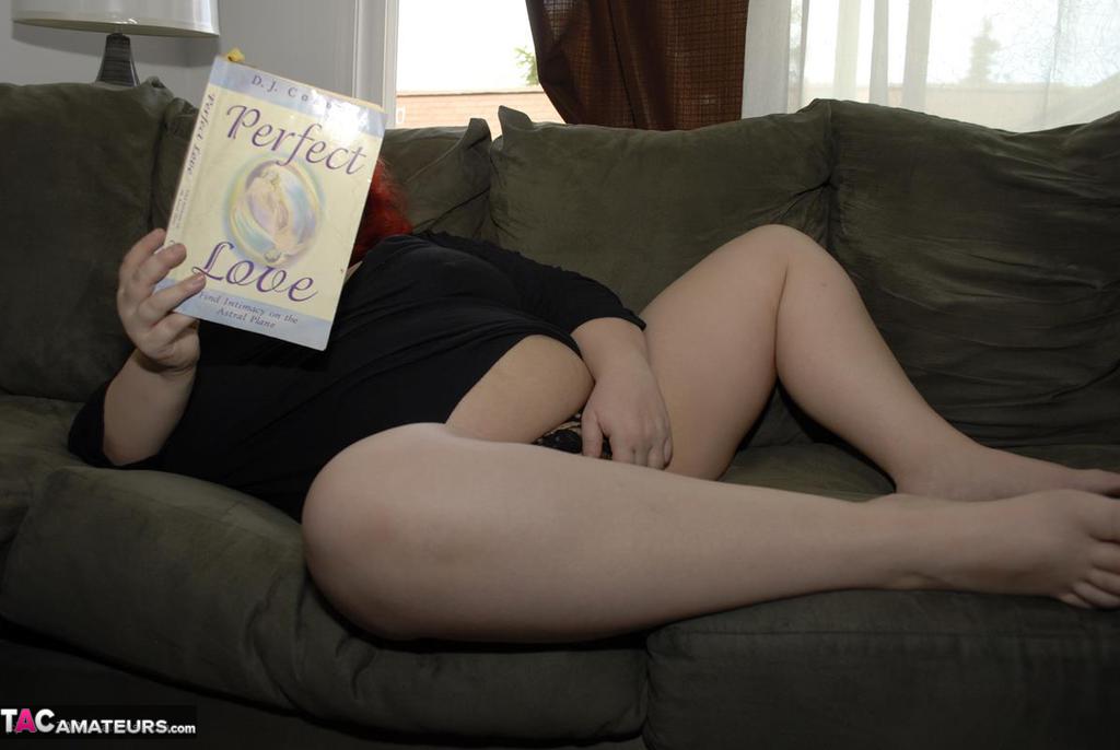 Obese older redhead Black Widow AK fondles herself while reading a romance porn photo #428140331