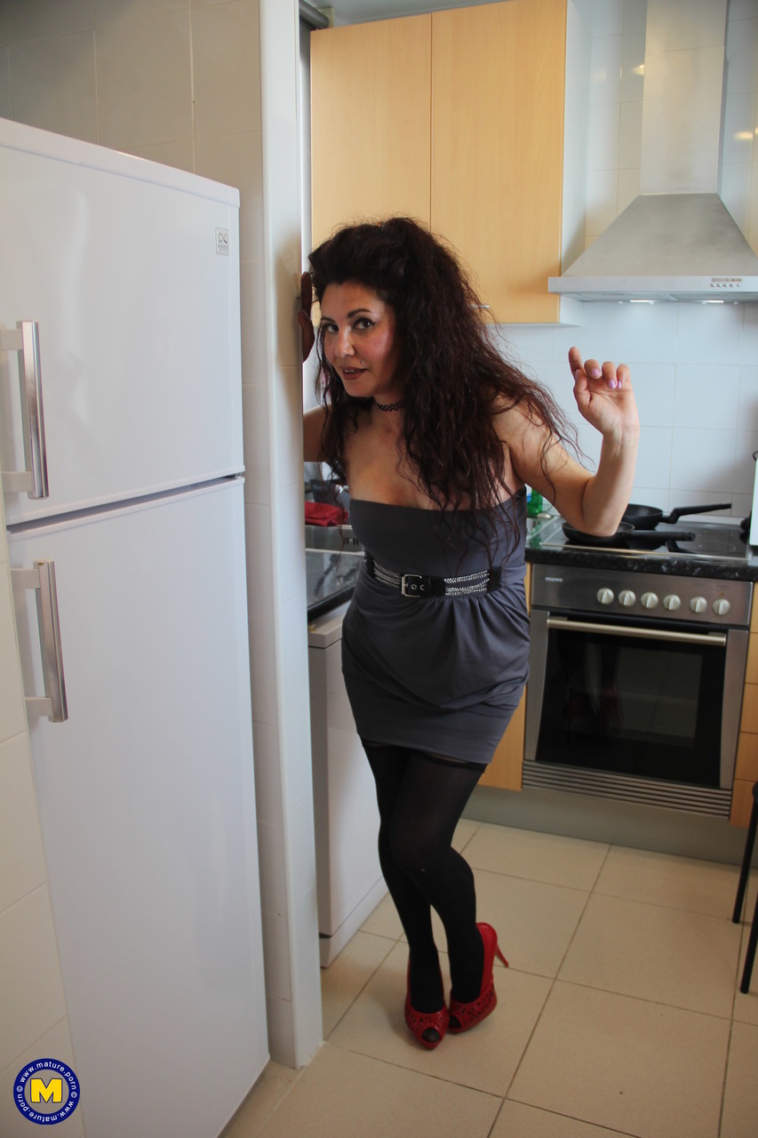 Naughty Spanish housewife playing in her kitchen porn photo #426893464