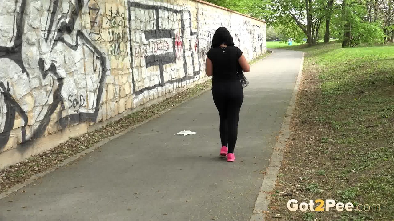 Lolita Black squats to piss outside on a path porn photo #425315306