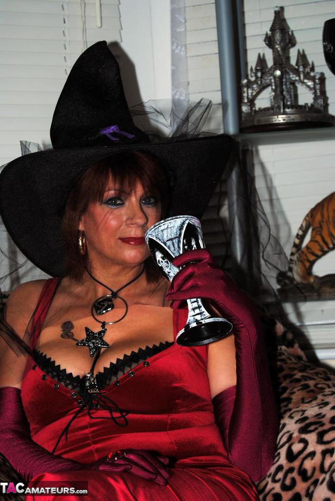 Sexy mature redhead Dimonty partakes in a pagan ritual in cosplay attire porn photo #423156127