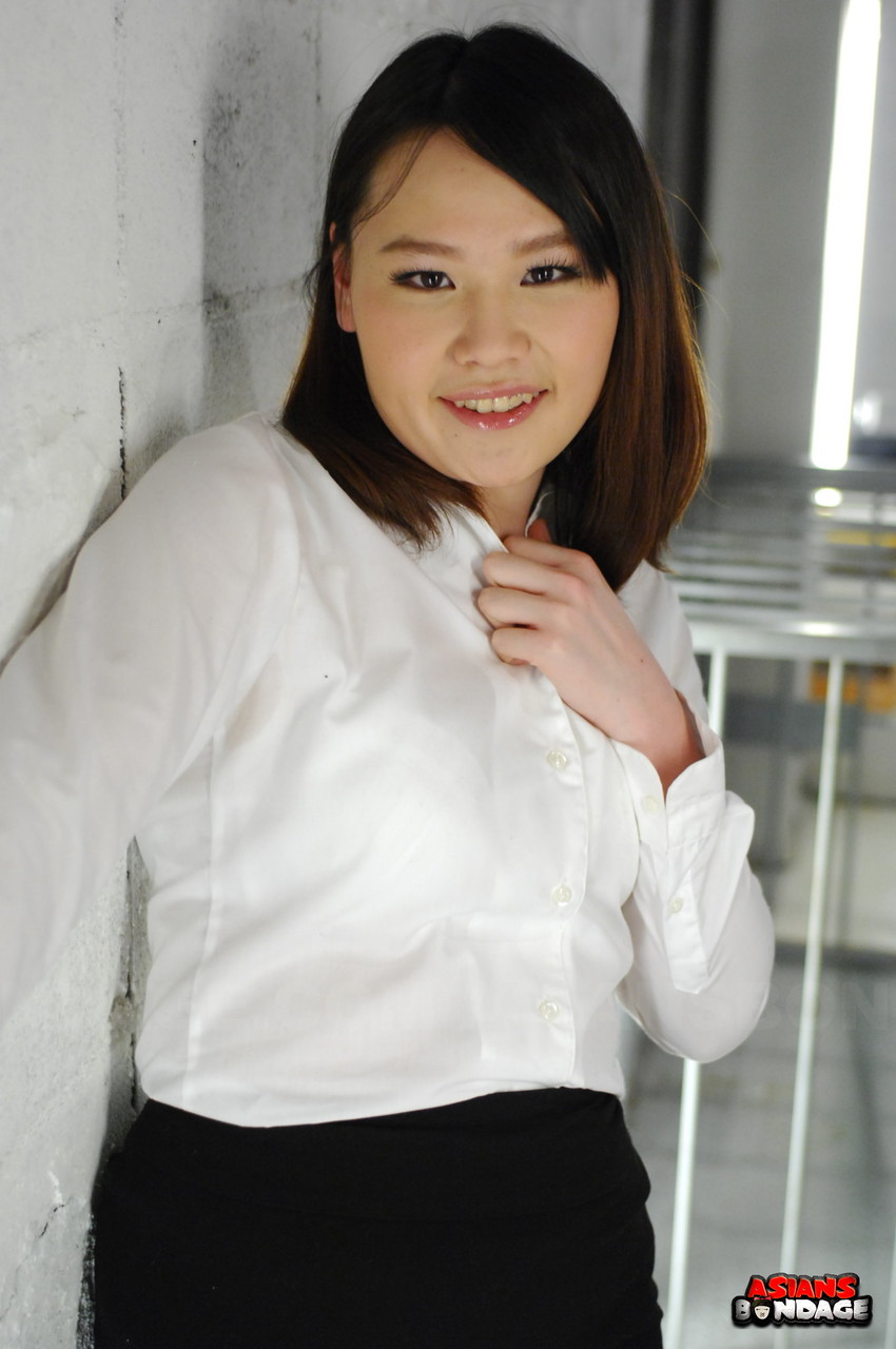 Asian chick Aki Sasahara is fitted with gag in white blouse and black skirt foto porno #426957144