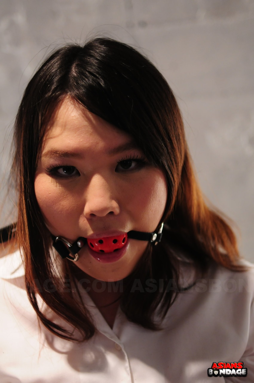 Asian chick Aki Sasahara is fitted with gag in white blouse and black skirt foto porno #426957148