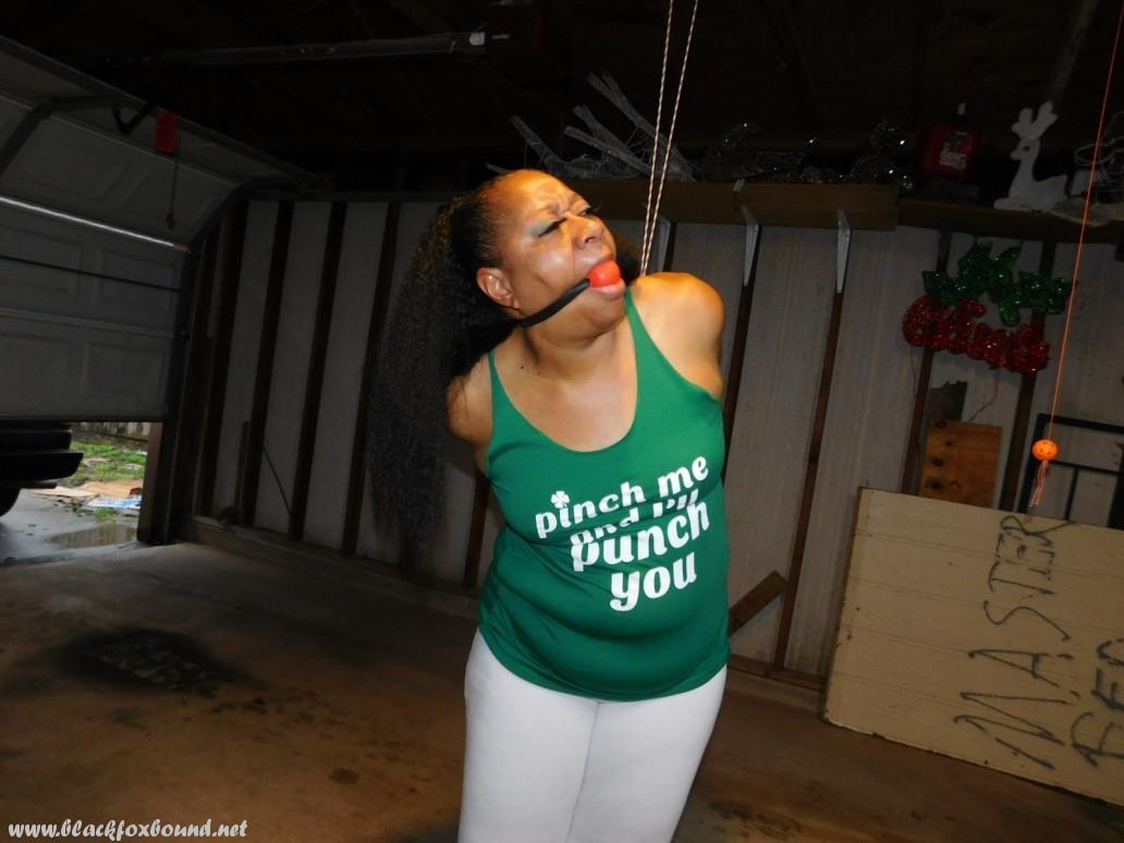 Ball Gagged Ebony Girl Struggles With Her Arms Tied Behind Her Back