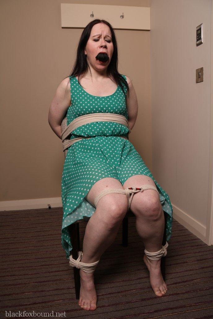 Distressed mature woman in polka-dot dress tied up & gagged for BDSM fun porn photo #428607968