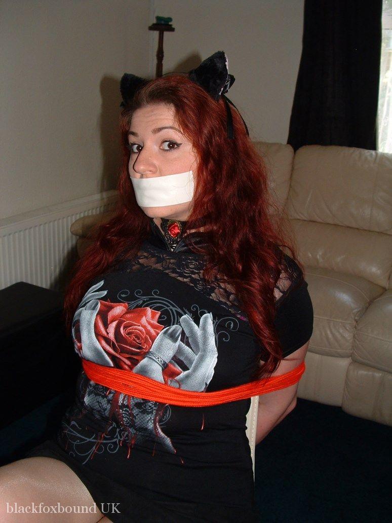 Thick redhead is tied to a chair with tape affixed to her mouth foto porno #429041177