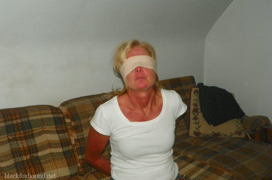 Blonde female is tied up with rope after being blindfolded and gagged foto porno #424890984