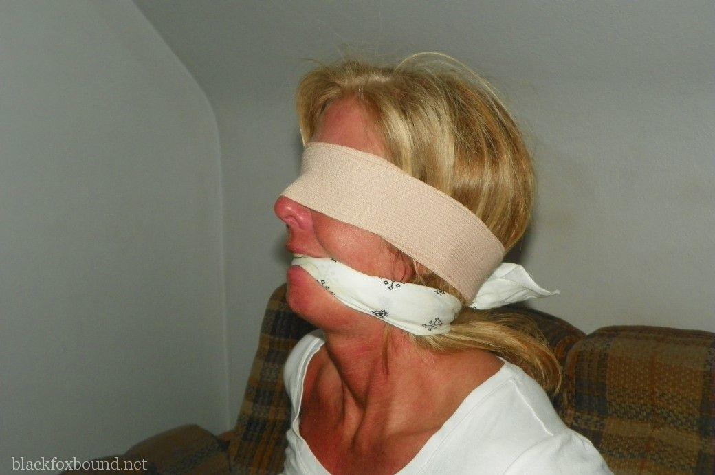 Blonde female is tied up with rope after being blindfolded and gagged porn photo #424890985