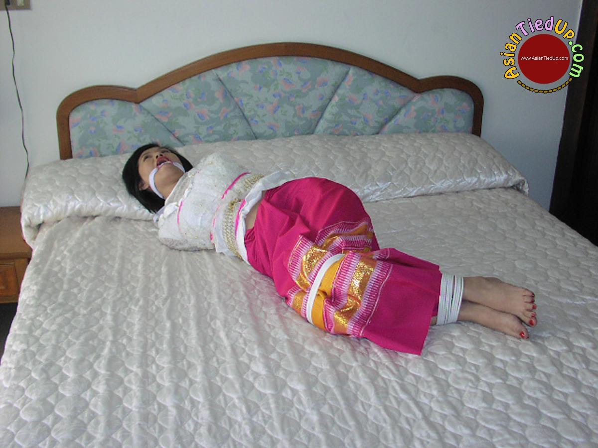 Bad Vacation of a Stupid Asian She is Left Hogtied and Gagged porn photo #428141488