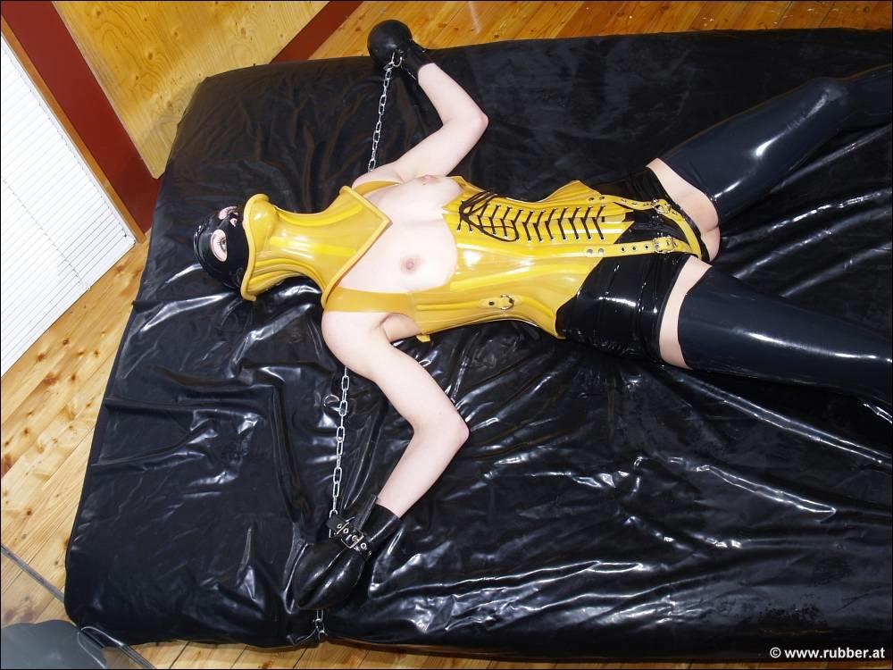 Dark Haired Girl Is Restrained And Masturbated In Latex Before Posing Alone