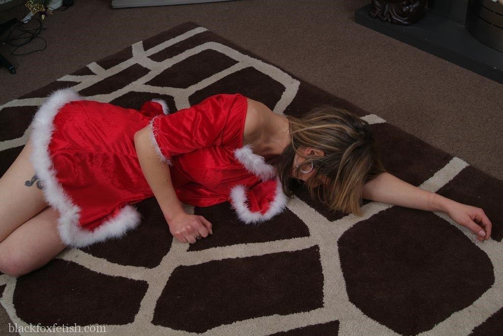 White girl is tied up and cleave gagged in Christmas clothing near the tree foto porno #422800348