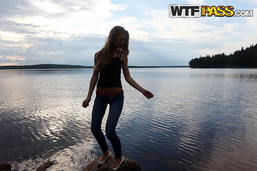 Girl next door Megan pulls out her tits while sitting on a rock in the lake ポルノ写真 #427190489