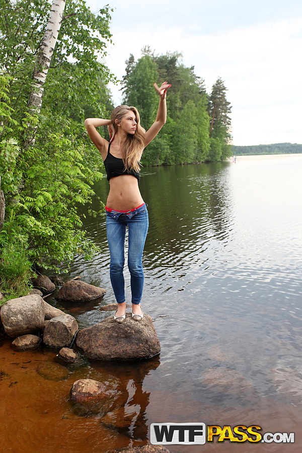Girl next door Megan pulls out her tits while sitting on a rock in the lake zdjęcie porno #427190505
