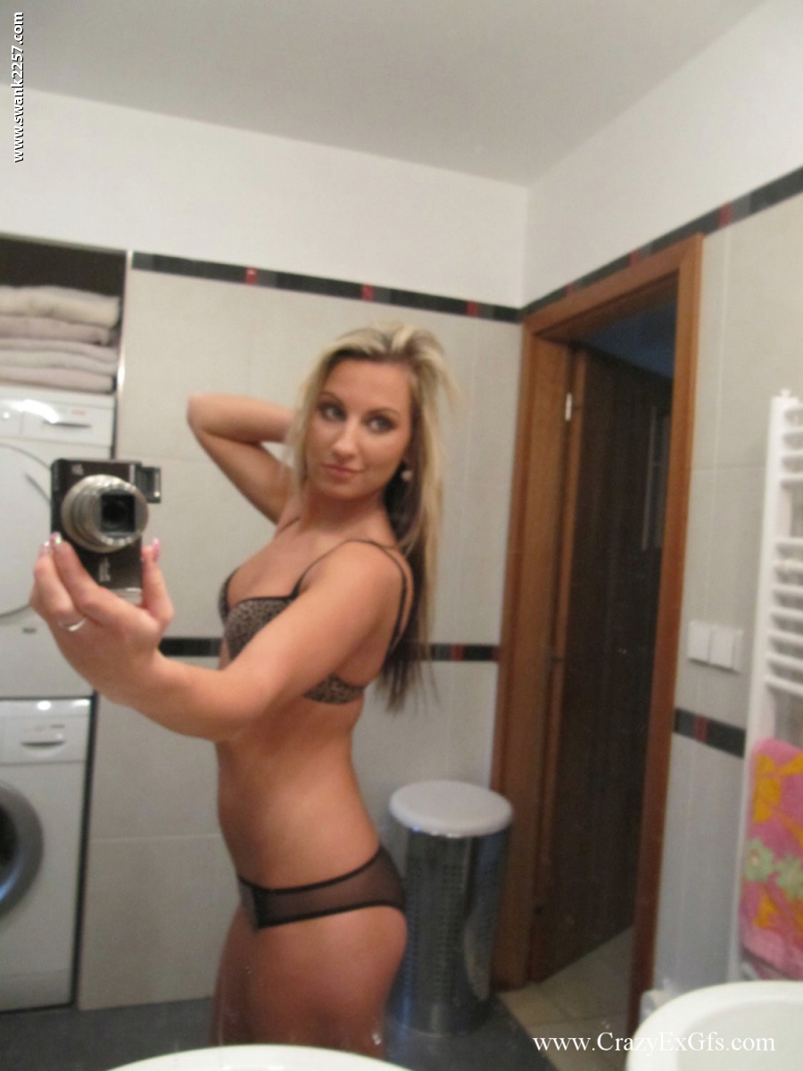 Blonde amateur gets totally naked while taking self shots in a bathroom mirror foto porno #427279999