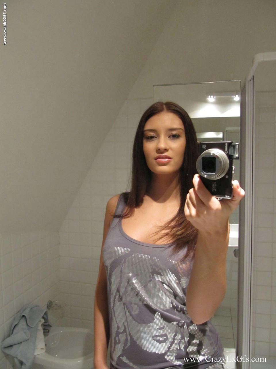 Amateur chick takes mirror selfies while stripping naked in bathroom picture