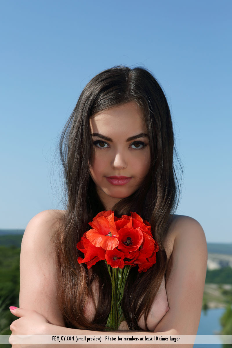 Charming brunette teen Annika A poses naked on hilltop with red flowers ポルノ写真 #425005191