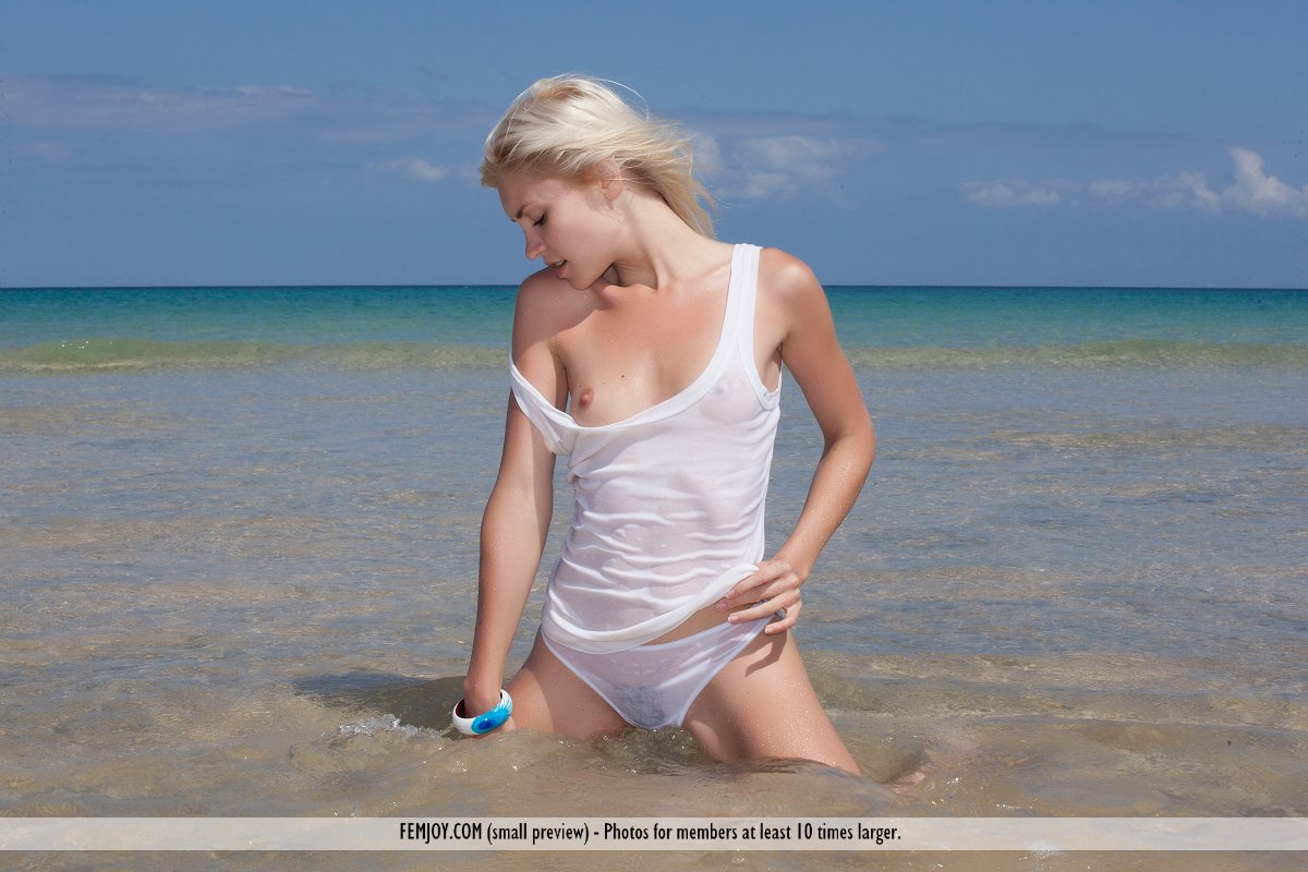 Blonde teen Kristy gets totally naked while playing in the ocean surf foto porno #426783090