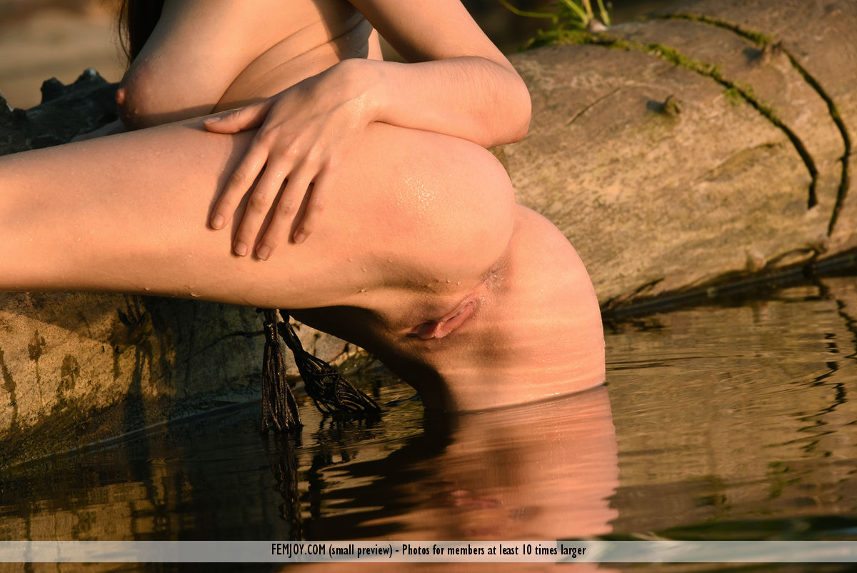 Young redhead Eva M strikes tempting nude poses while in the ocean porno foto #424568588