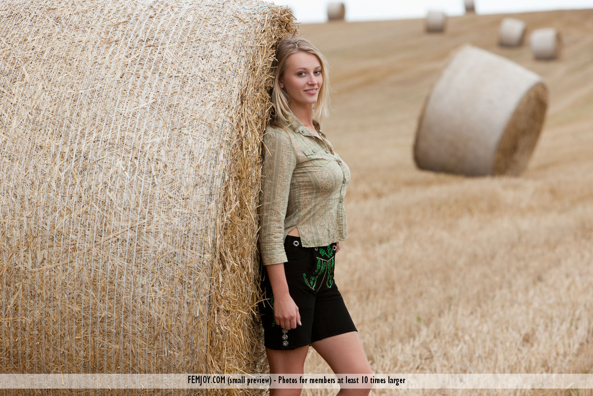 Beautiful blonde teen Carisha strips naked next to a round bale of hay porn photo #427824121