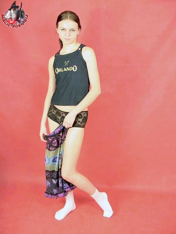 Petite teen strips down to white socks in a confident fashion порно фото #427767930