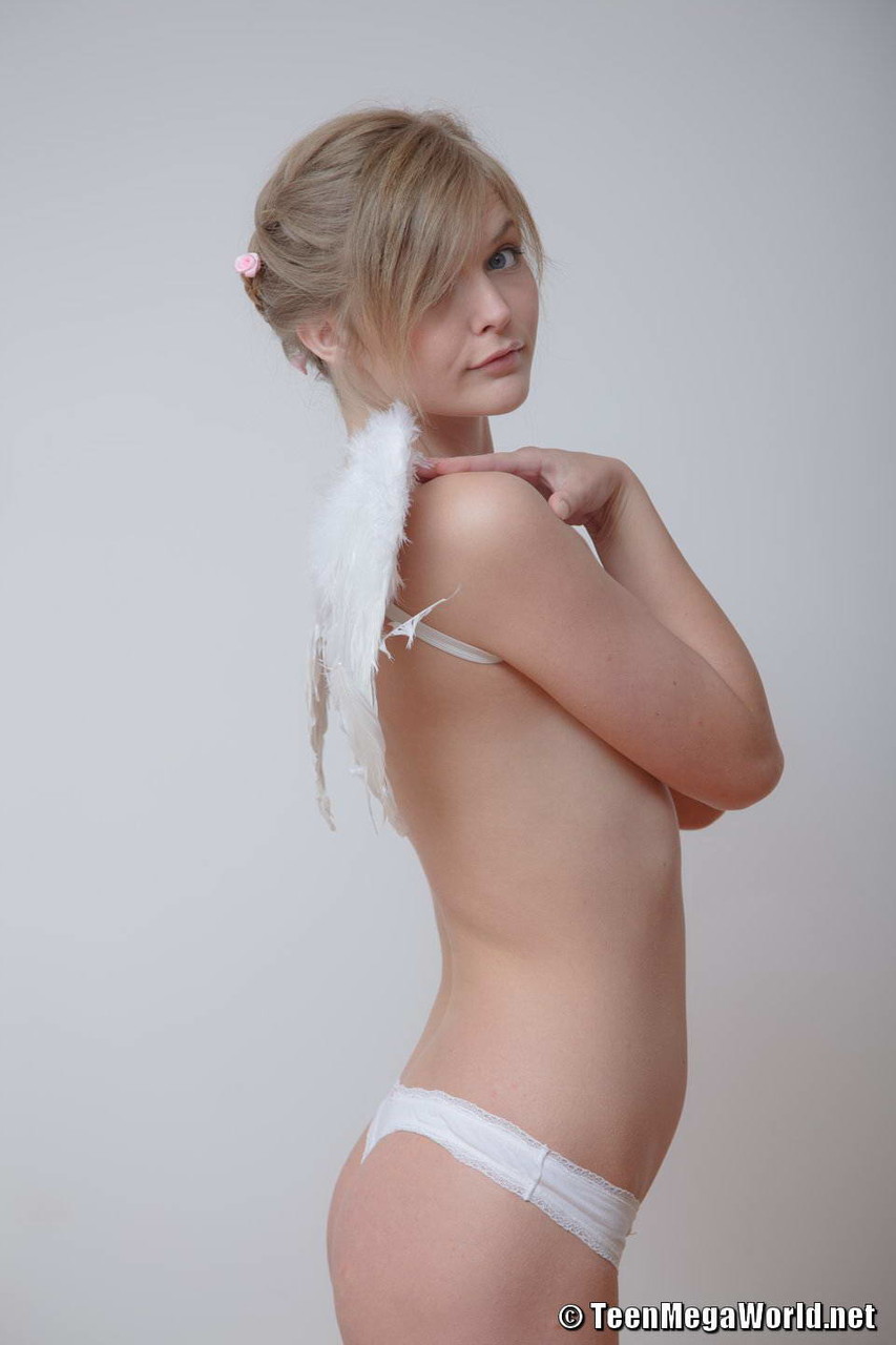 Adorable teen strikes tempting poses in socks and Angel wings porn photo #426927251