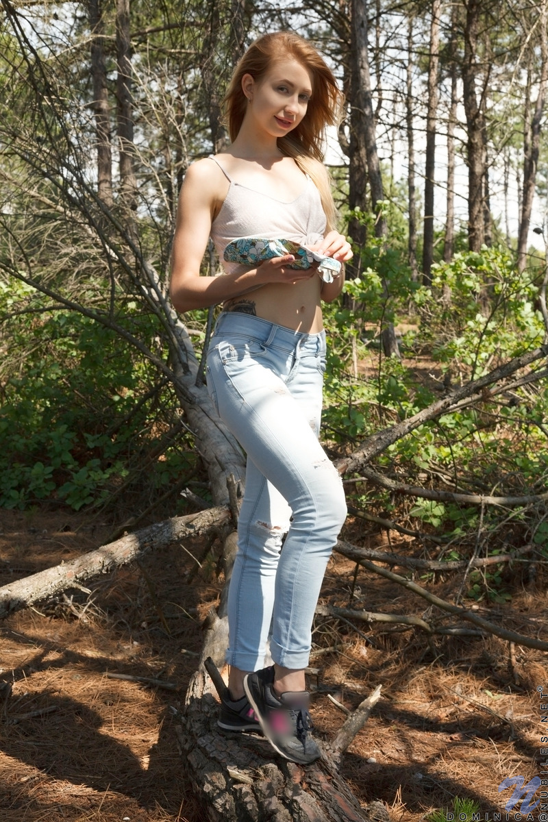 Teen girl Dominica slips off faded jeans to show her bald twat in the woods porn photo #428414180