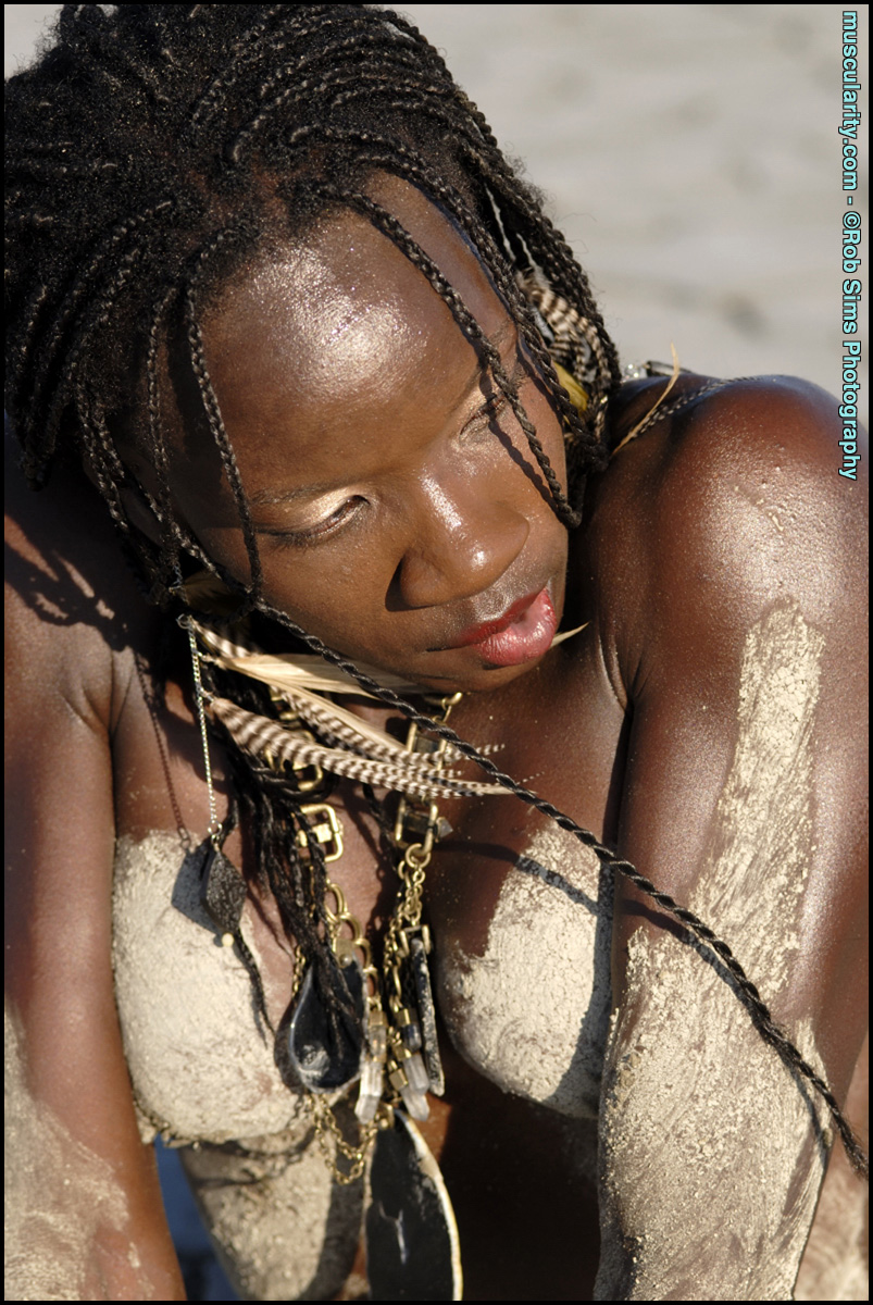 Ebony bodybuilder Camille Elizabeth covers her toned body in beach sand porn photo #424746528