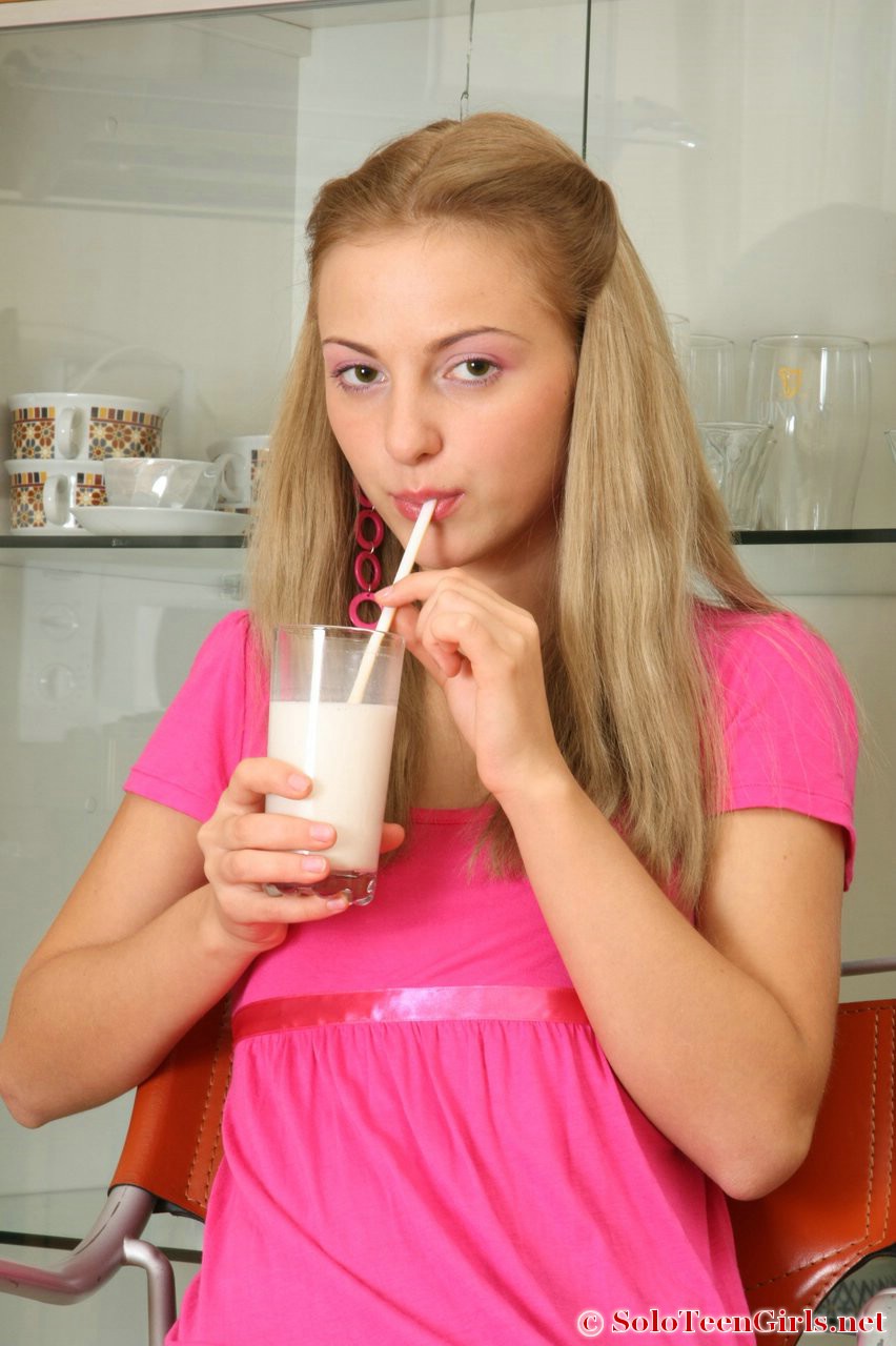 Young blonde drinks a glass of milk before toying her pussy in sexy stockings foto porno #423828431
